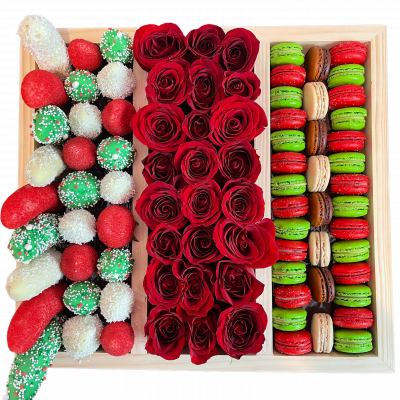 Sweet box with fresh roses, macarons and chocolate covered fruits