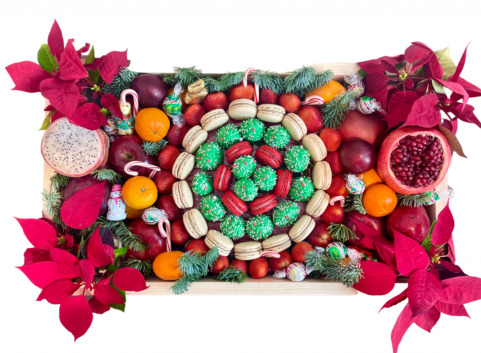 Christmas fruit box with fresh fruits and macarons and flowers