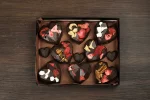 Delight in our "Chocolate Hearts Gift Box," where every chocolate heart is filled with a surprise of nuts, marshmallows, or strawberries, a sweet way to convey your love.