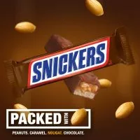 "Close-up of a Snickers chocolate bar showcasing its layers of nougat, caramel, and peanuts.