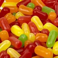 Close-up of colorful Mike and Ike candies, showcasing their oblong shape and vibrant hues.