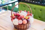 Luxe Fruit and Bloom Basket NYC featuring fresh fruits and flowers by WOW Bouquet.