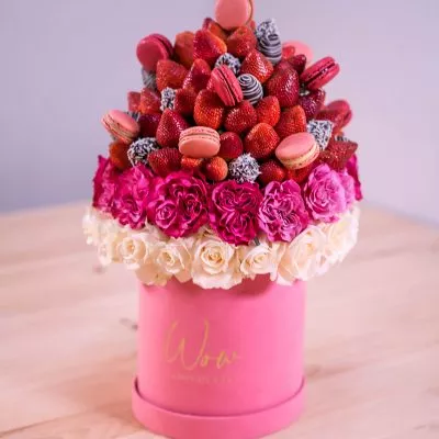 Strawberry bouquet with vibrant red roses centerpiece