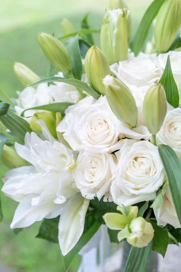 NYC's finest white rose and lily arrangement in the 'Pure Serenity' bouquet.