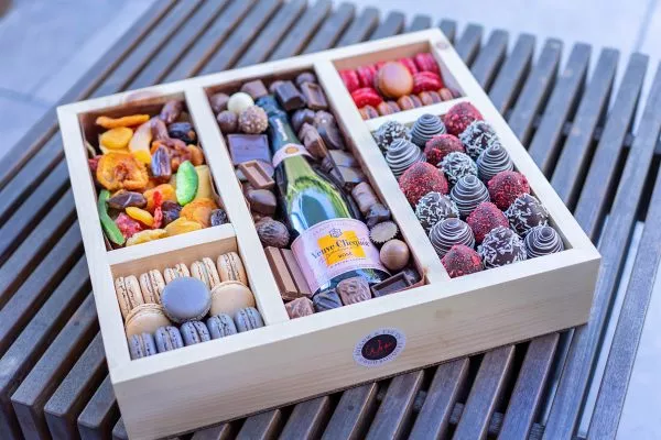 Holiday celebration in a box: champagne, sweet macarons, and more