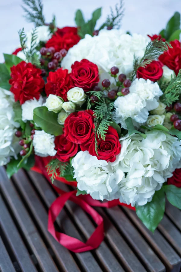 Delicate white spray roses in the holiday garden bouquet.