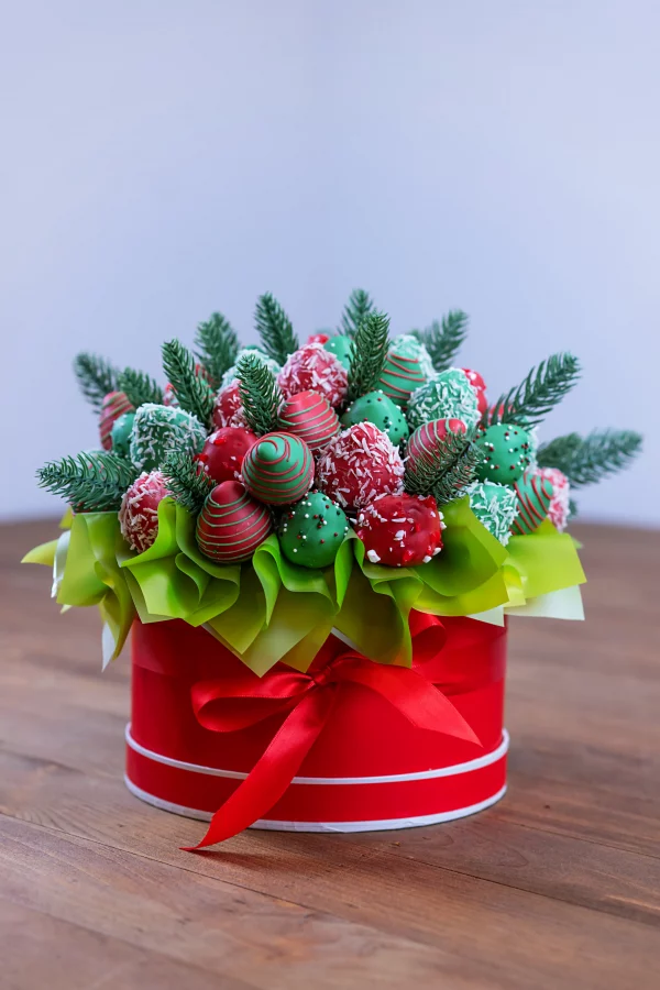 A red circle gift box filled with holiday treats.