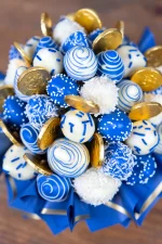 Hannukkah-themed strawberry bouquet with chocolate coins.