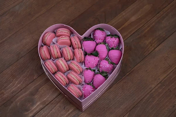 Close-up of the Valentine's Pink Macarons & Berries Box with a focus on the delicate pink macarons.