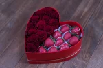 Vibrant red roses and chocolate-covered strawberries in the Passionate Red Rose & Berry Box.