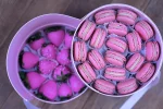 Luxurious Valentine's Day gift featuring pink macarons and Belgian chocolate-covered strawberries