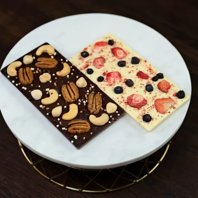 Image of WOW Bouquet's duo chocolate bars: dark chocolate with nuts and white chocolate with freeze-dried berries