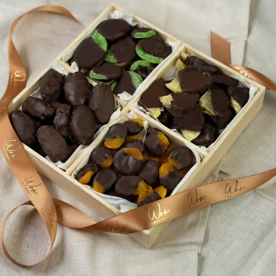 Dark Chocolate Dried Fruit Gift Box with a variety of chocolate-covered dried fruits, including kiwi, Medjool dates, pineapples, and apricots, in a 10x10 box.