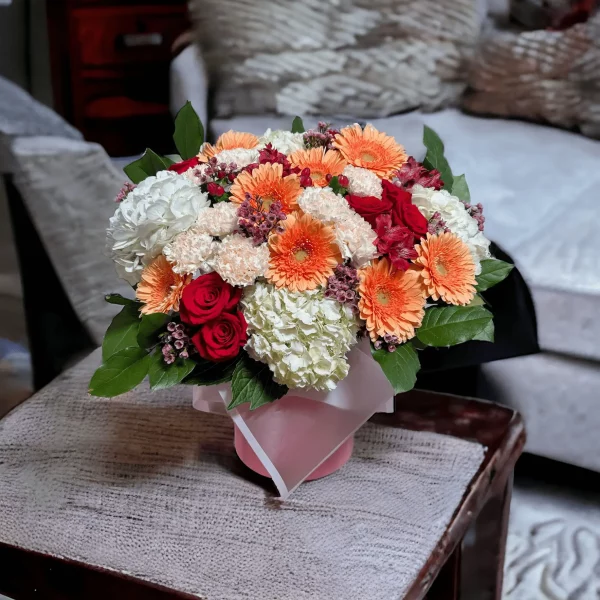 The Petal Palette floral arrangement, an artistic display of seasonal blooms, featuring a diverse selection of flowers to celebrate the spring season.