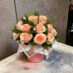 A captivating arrangement of pink roses in a premium box