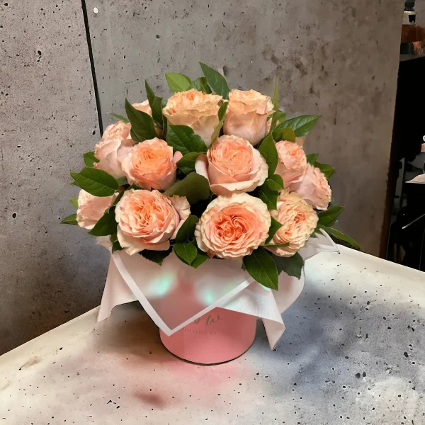A captivating arrangement of pink roses in a premium box
