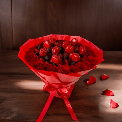 Chocolate-covered strawberries and red roses bouquet